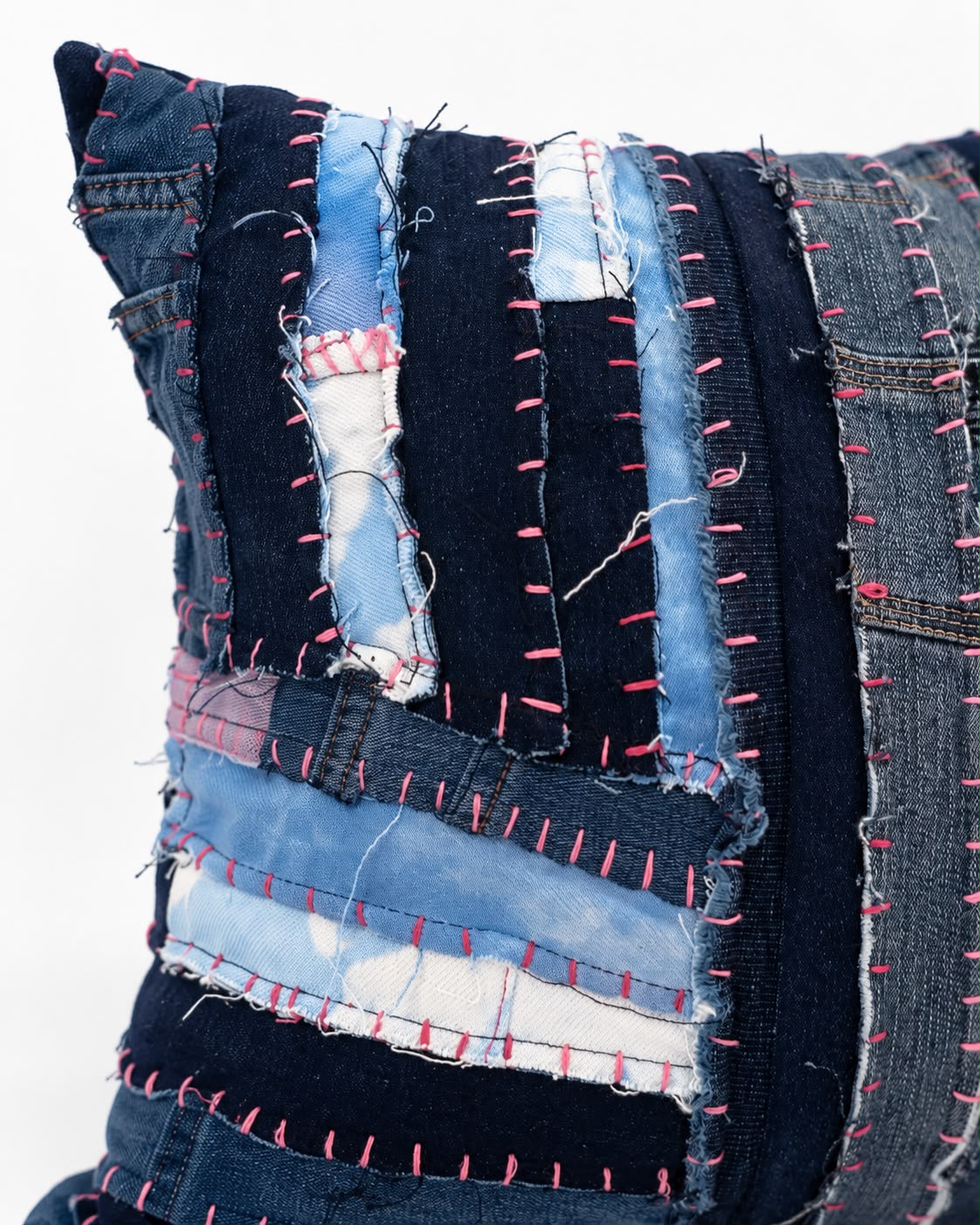 Mended in pink indigo hand patched recycled denim cushion cover